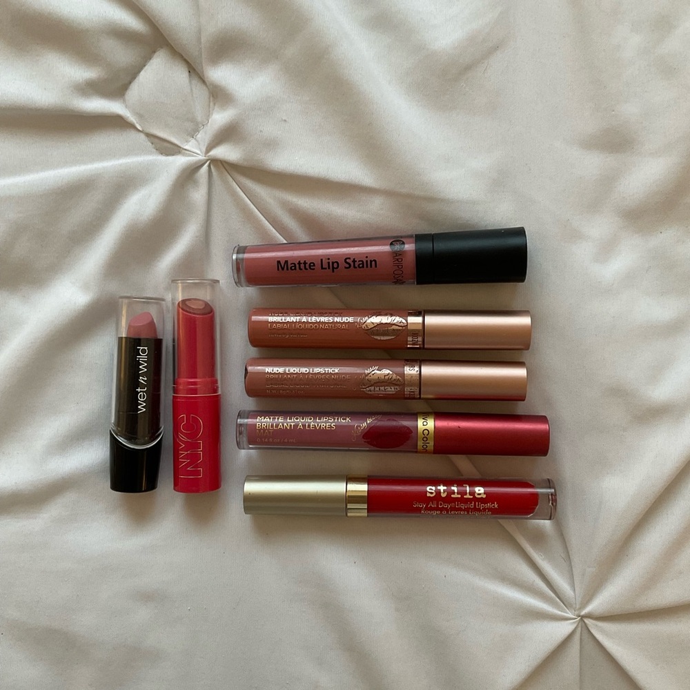 Bundle of pink, mauve and red lipsticks and liquid lipsticks